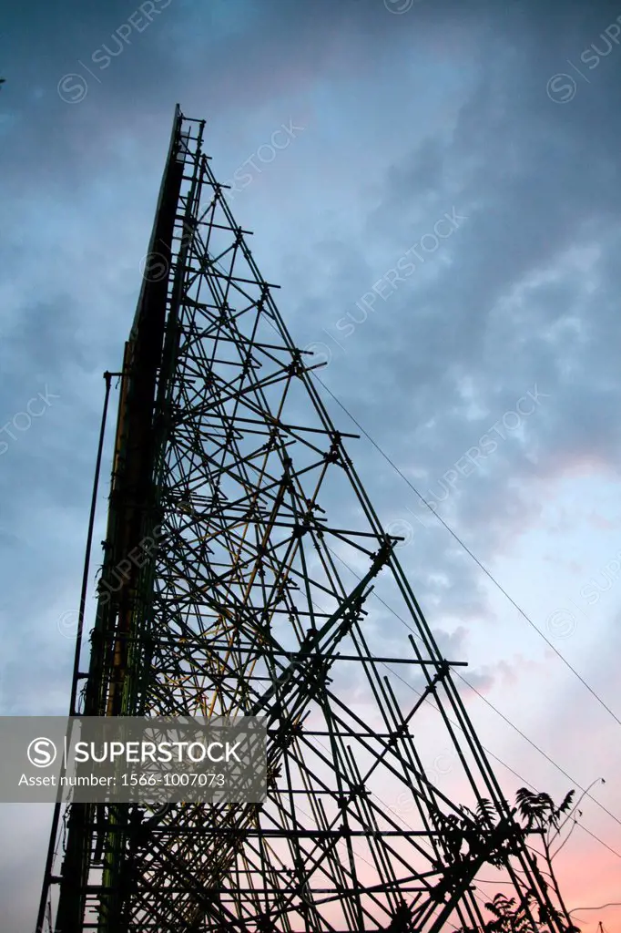 big advertising billboard with scaffold structure with dark sky at night