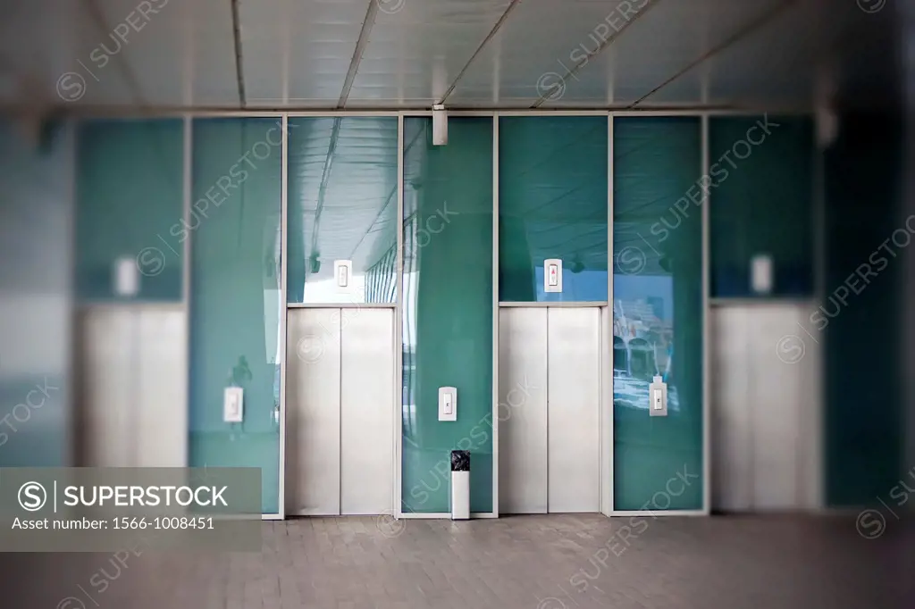 Four lifts in ´Veles e Vent´ building in Port of Valencia, Spain, with photographer selfportrait