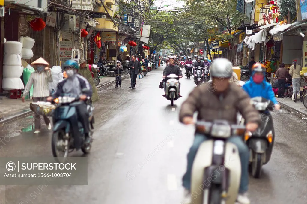 A busy street with scooters and motorcycles in Vietnam