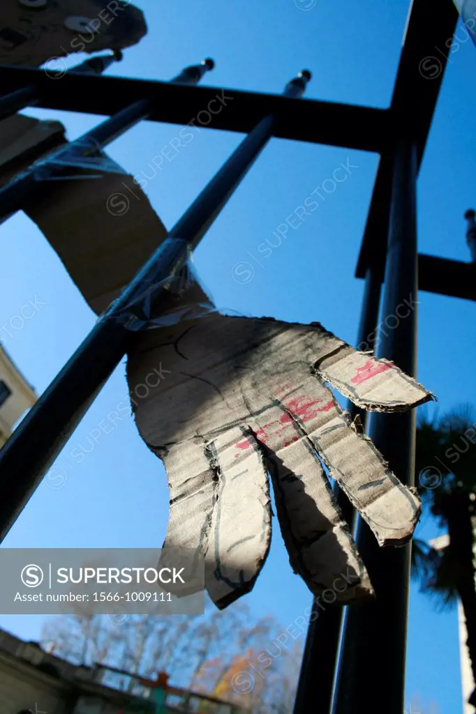 cardboard hand cutout by university college gate in rome italy