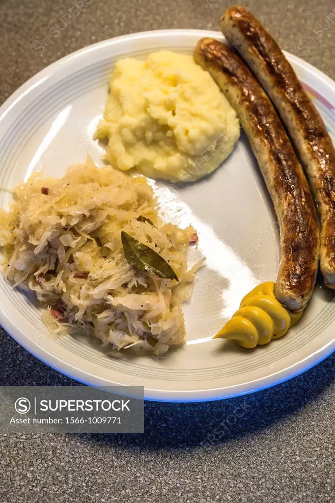 Fried sausage Bratwurst with Sauerkraut and mashed potatoes