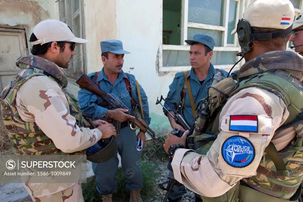 Dutch police mentors walking patrol with Afghan police officers in Kunduz