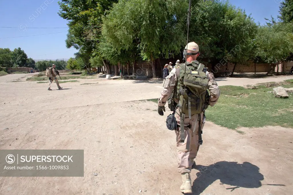 Dutch police mentors walking patrol with Afghan police officers in Kunduz