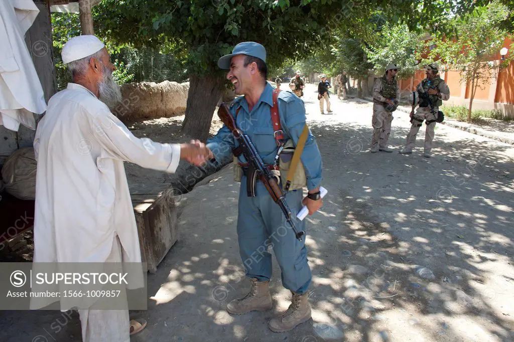 Afghan national Police officers walking patrol in Khanabad, Kunduz  Dutch military are supervising them