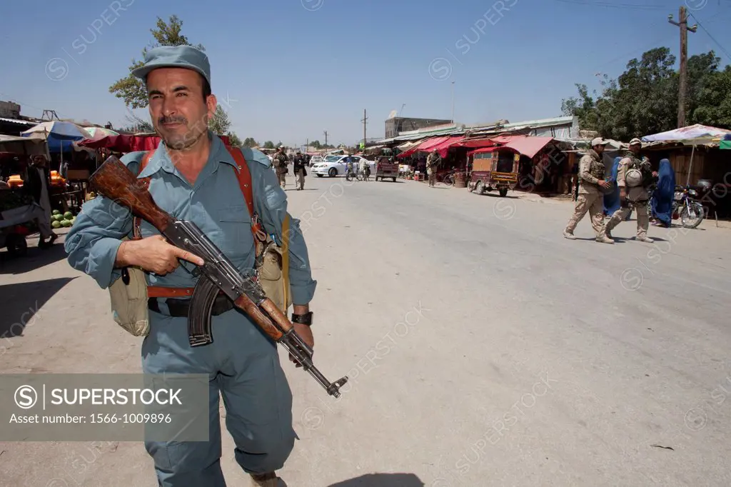 Afghan national Police officers walking patrol in Khanabad, Kunduz  Dutch military are supervising them