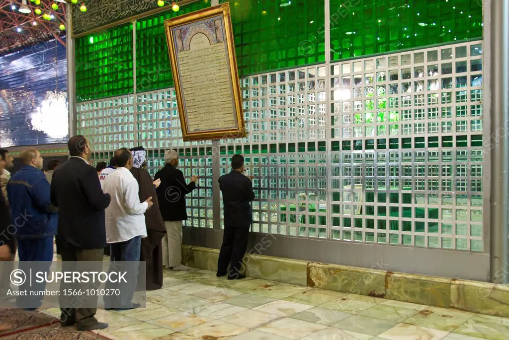 Pilgrims praying in front of the Ayatollah Khomeini mausoleum in Tehran, Iran