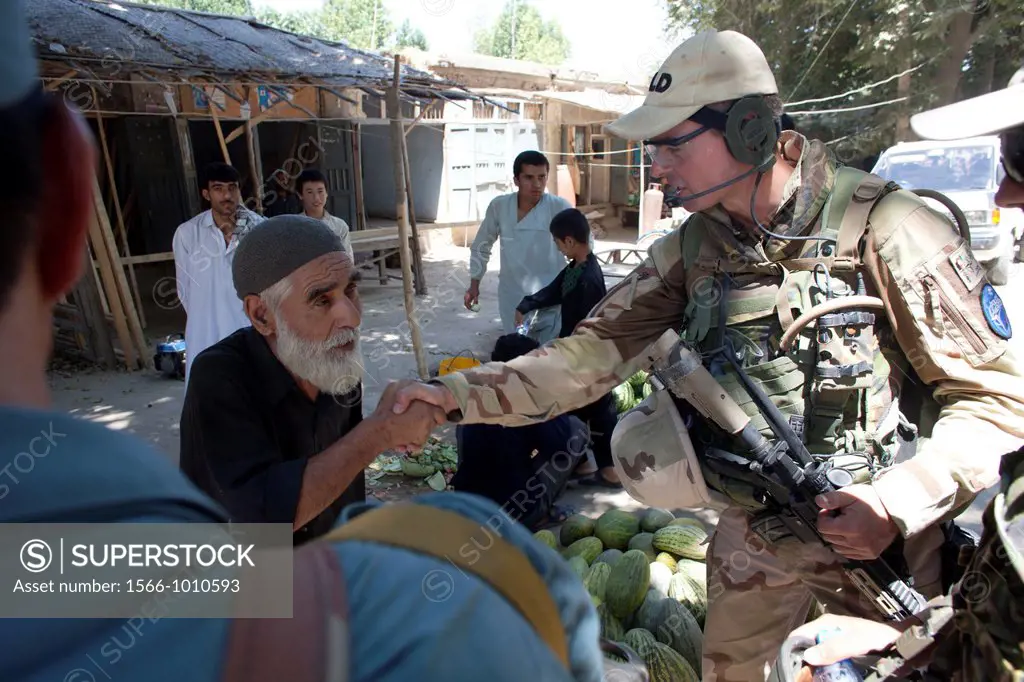 Dutch police mentors walking patrol with Afghan police officers in Kunduz