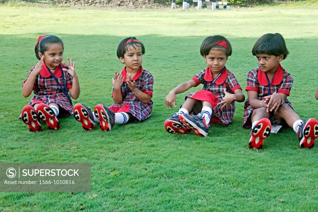 Pre Primary Students doing Exercise on Ground, India