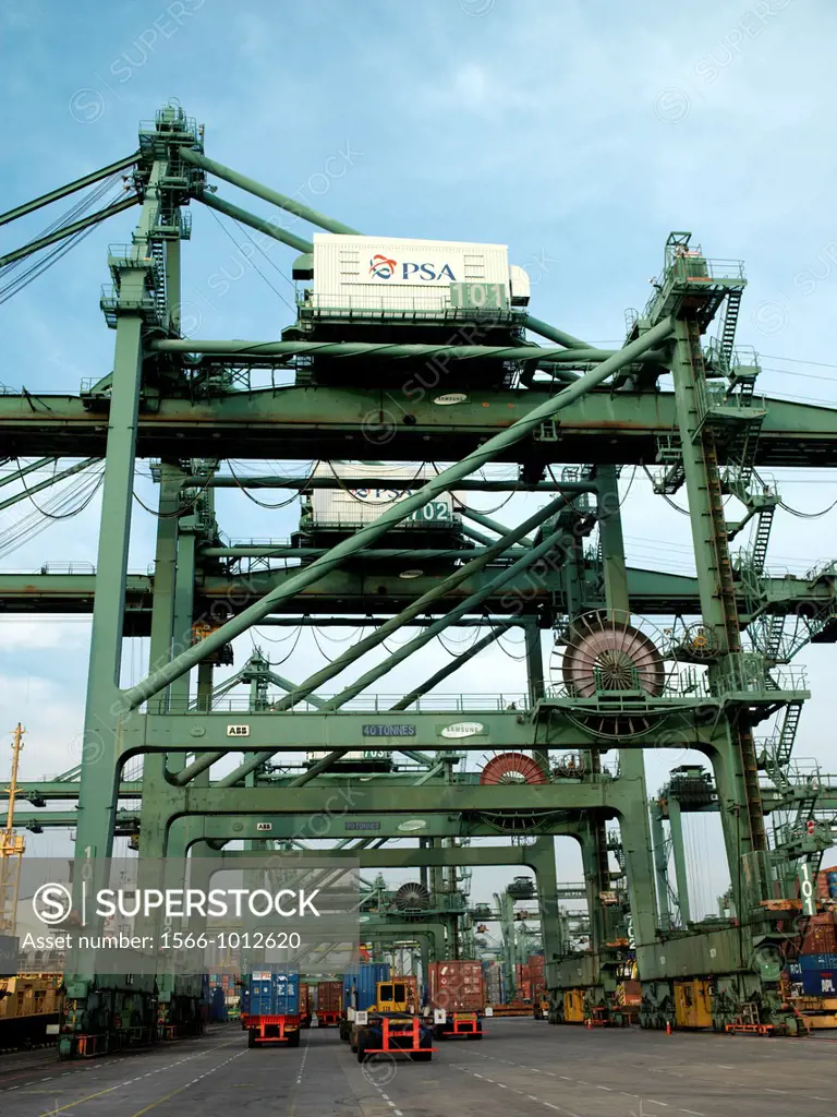 Huge machinery for the transport of containers from cargo liners to the port at the Port of Singapore Authority PSA in Singapore  PSA Singapore Termin...