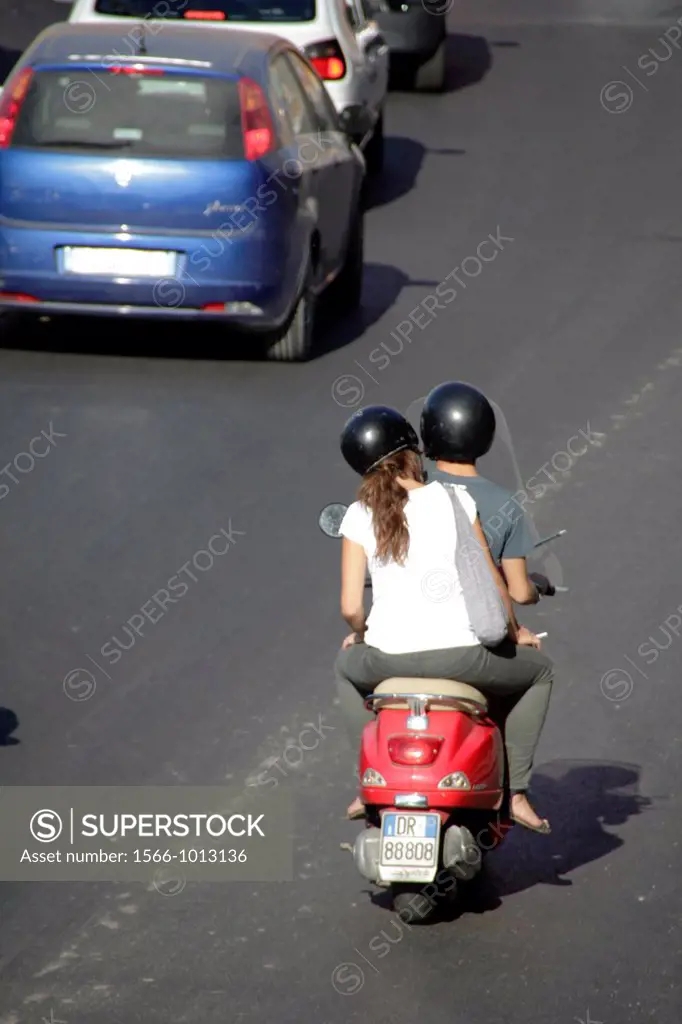 couple on a scooter in rome italy