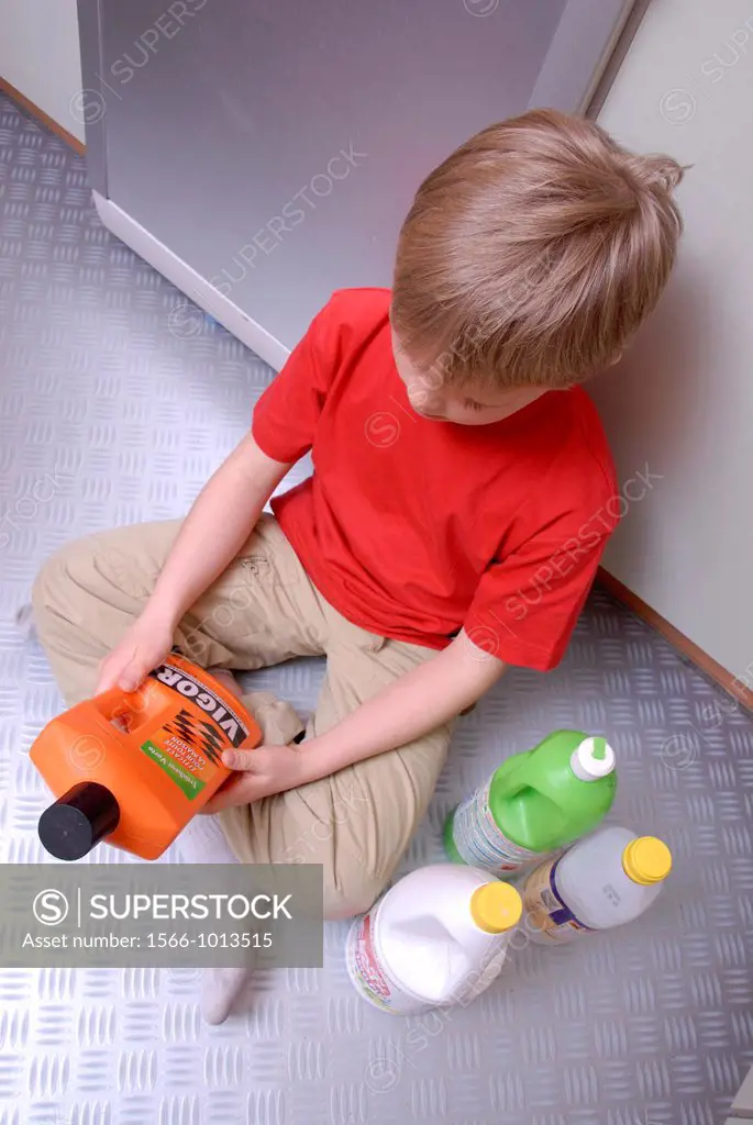 Young boy with cleaning products