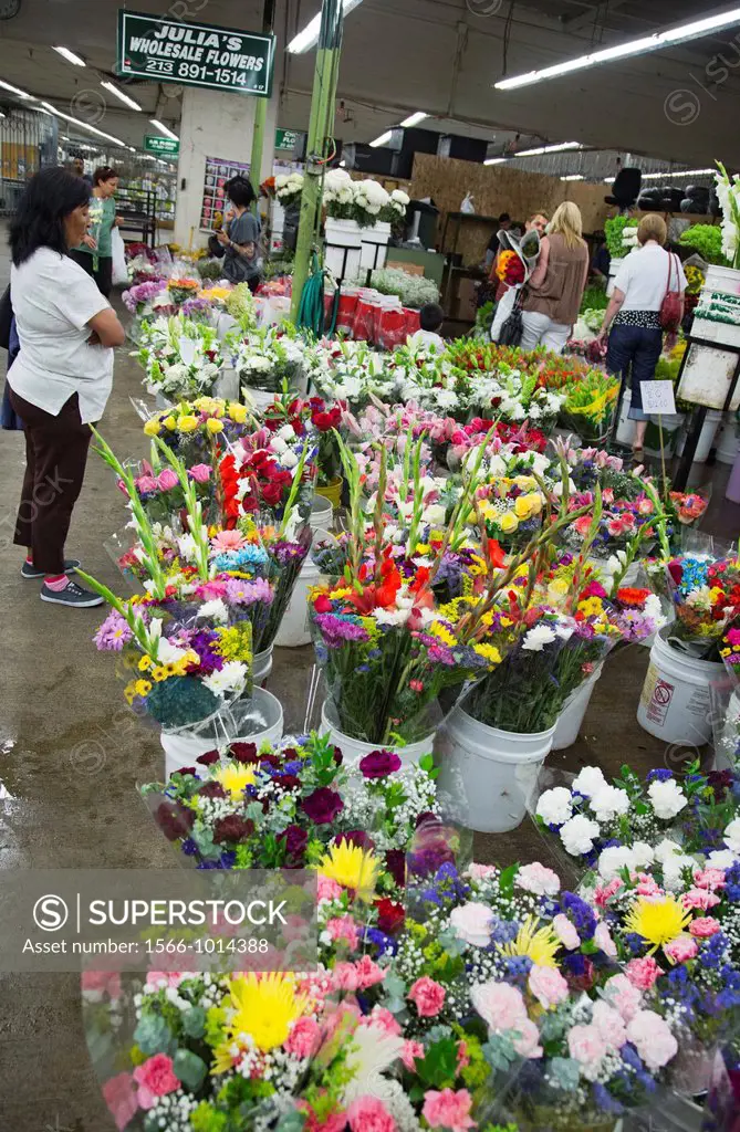 Los Angeles - A shopper in Los Angeles´ flower market  Most flowers sold in the market are imported
