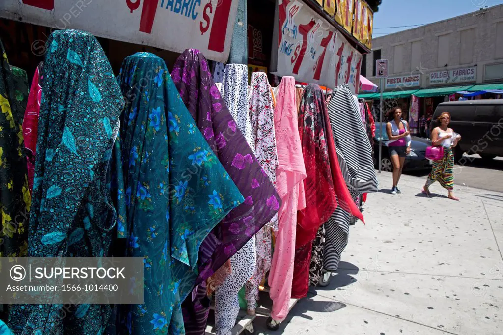 Los Angeles, California - Clothing and fabric for sale on the sidewalk outside stores in the fashion district