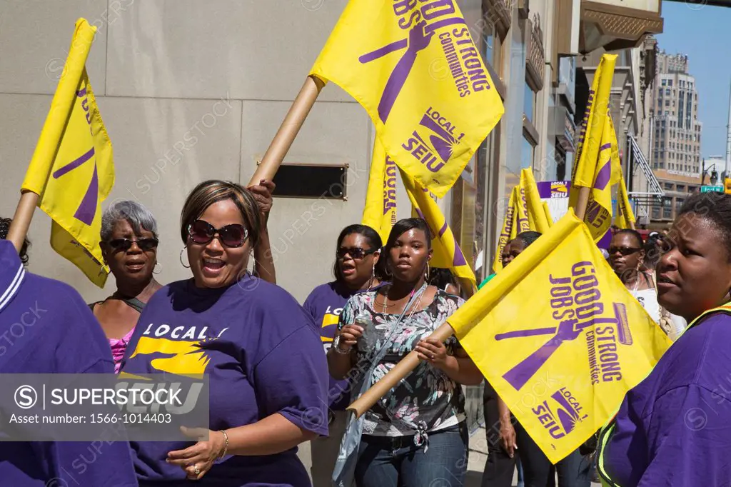 Detroit, Michigan - Janitors march through downtown Detroit, calling for a wage increase in their new union contract  The workers, who clean office bu...