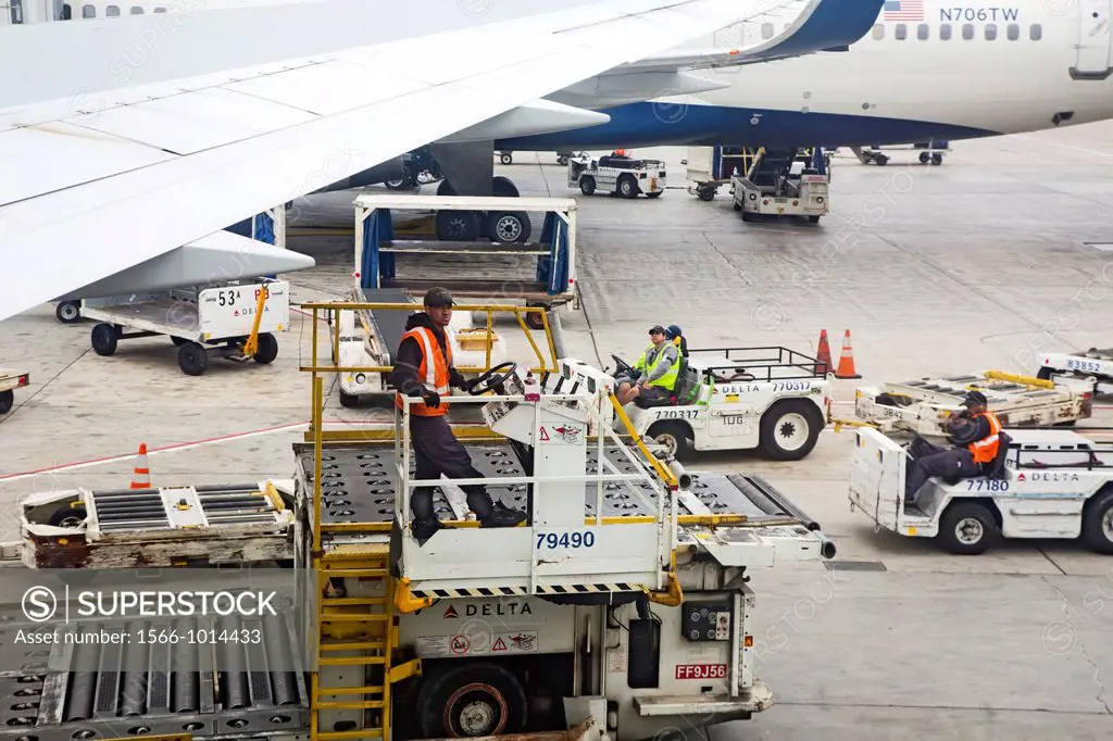 Los Angeles, California - Baggage handlers and other ground crew members await the arrival of a Delta Airlines jet at Los Angeles International Airpor...