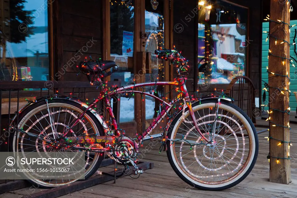 USA, Colorado, Crested Butte, Elk Avenue, bicycle covered in colored lights