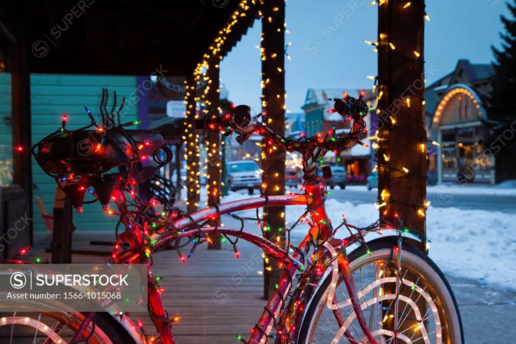 USA, Colorado, Crested Butte, Elk Avenue, bicycle covered in colored lights