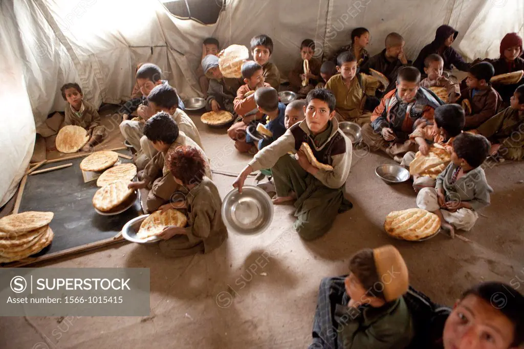 Afghan student gets food at school