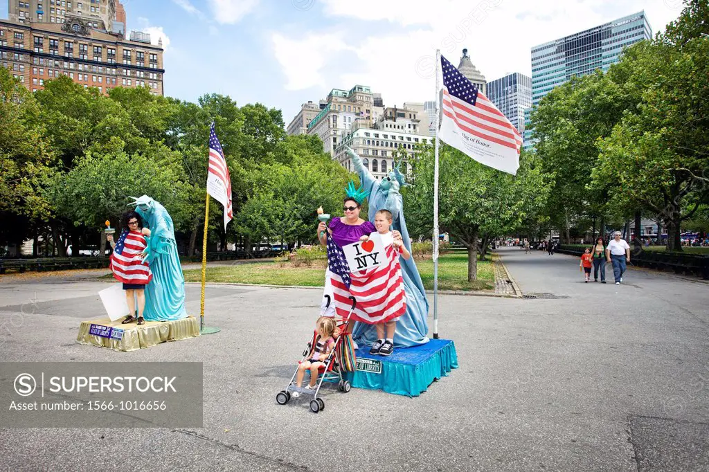 Mime mimics Statue of Liberty, Battery Park, Manhattan, New York City, USA.