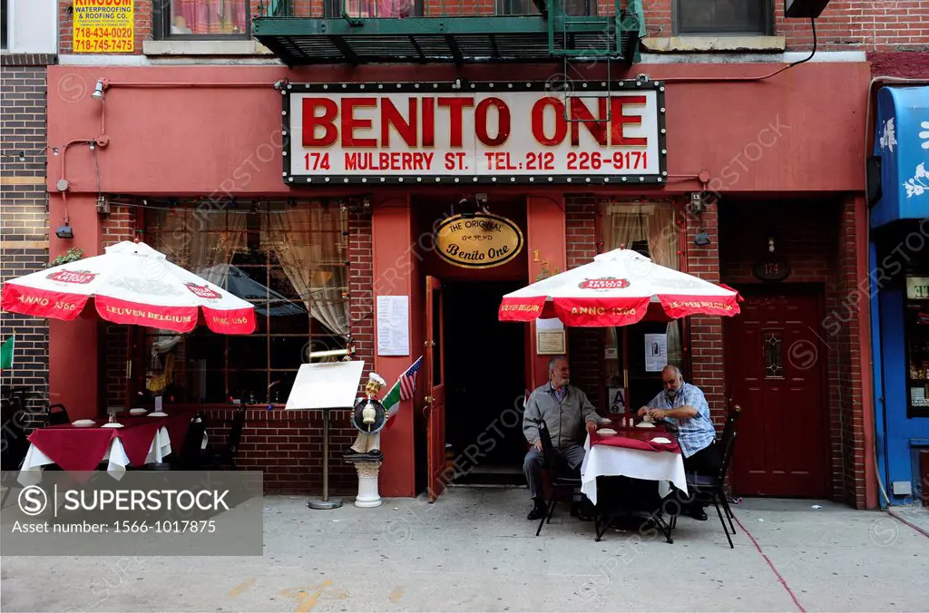 People sitting outdoors at a small italian restaurant on Mulberry Street in the Little Italy section of Lower Manhattan,New York City,New York states,...