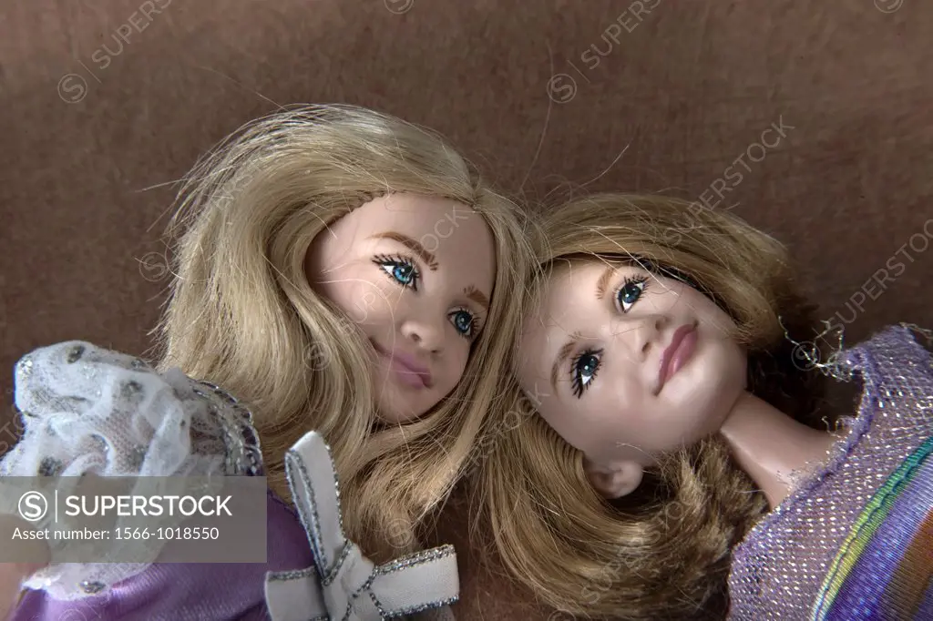 Close-up of two female dolls