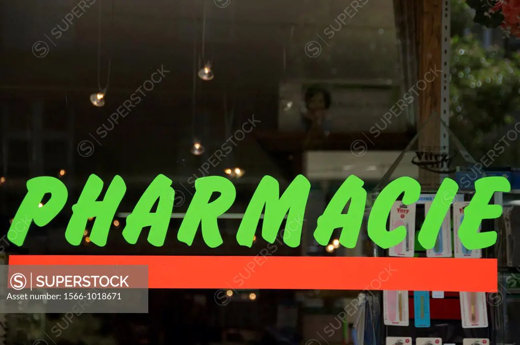 Pharmacie written in green letters on window of chemist´s shop, in french in France, Horizontal