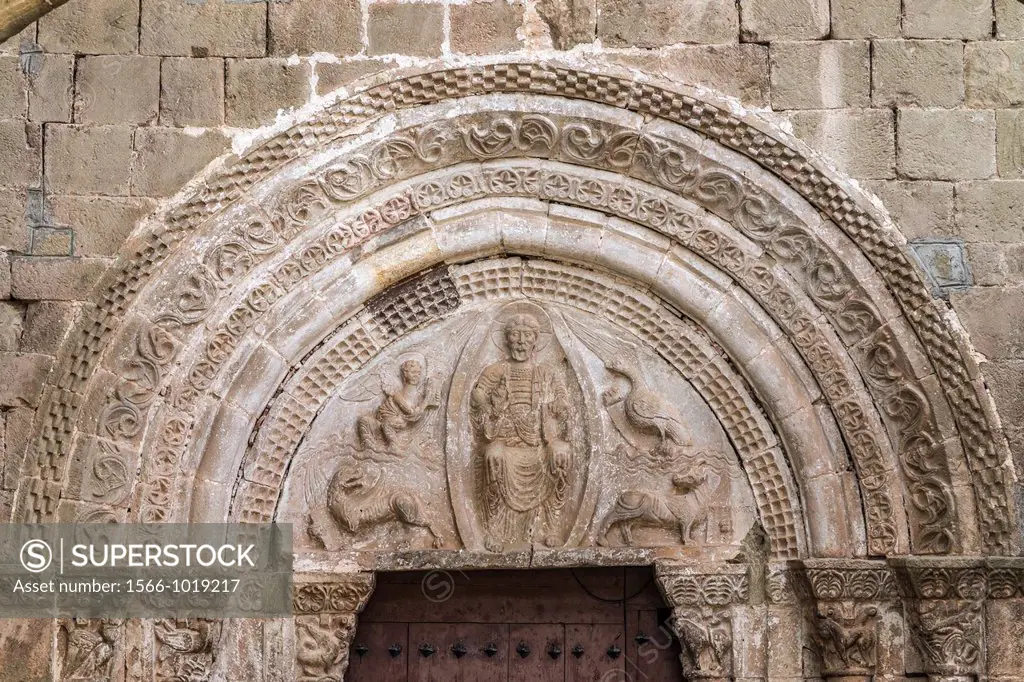 Detail of Romanesque portal of the church of St. Salvador in small town Agüero at the foot of Mallos rocks in Aragón, Spain