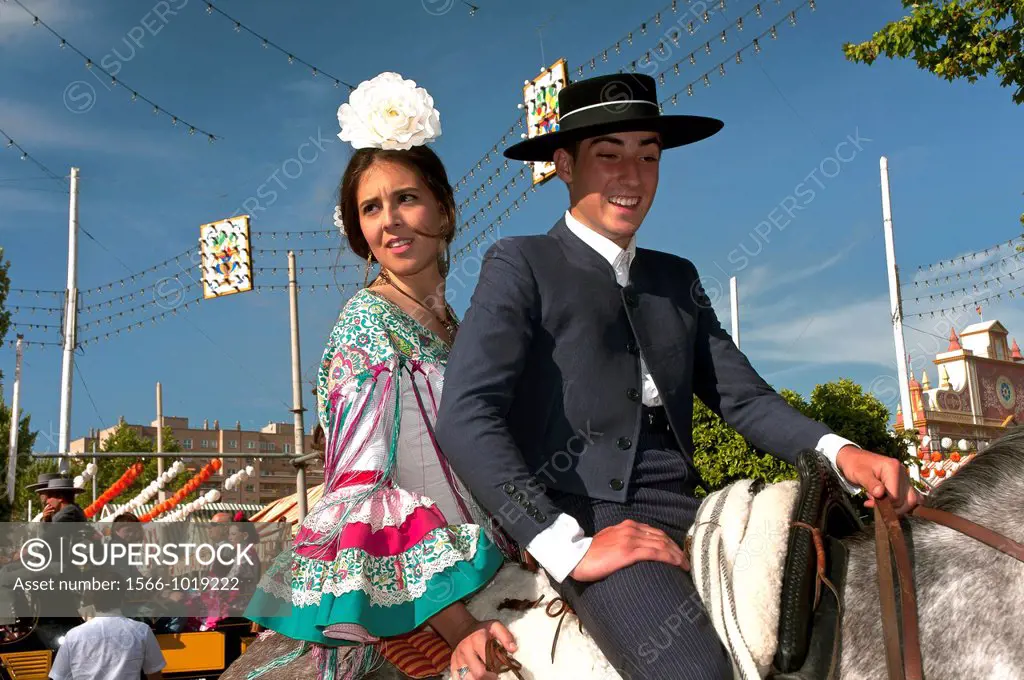 April Fair, Couple in traditional costumes on a horse, Seville, Spain