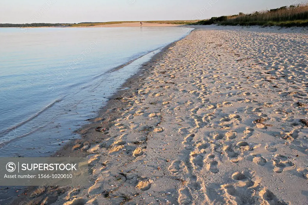 Footprints in the sand a little before sunset, on Veterans Park Beach, Hyannis, Cape Cod, Massachusetts