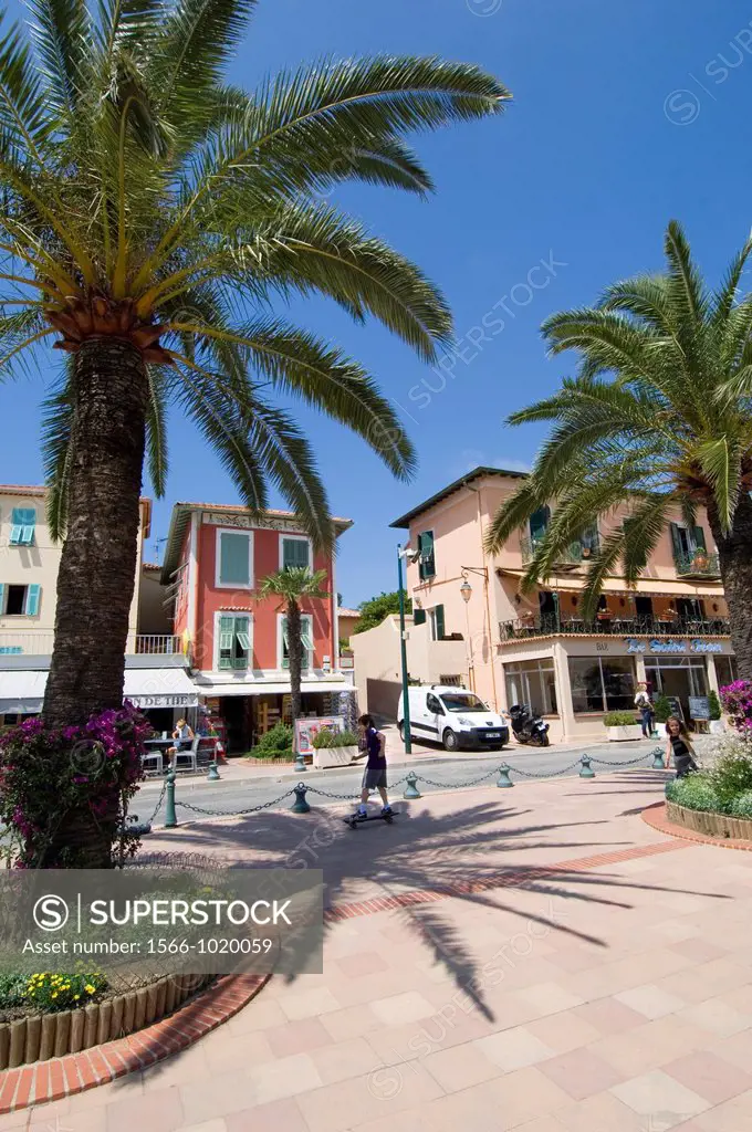 St Jean Cap Ferrat, South of France, Boy on Skateboard in the middle of the village, Palm trees