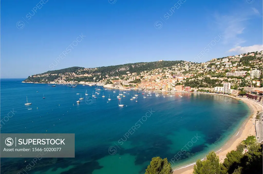 Villefranche sur Mer seen across the bay, South of France, sailing boats at anchor, beach visible