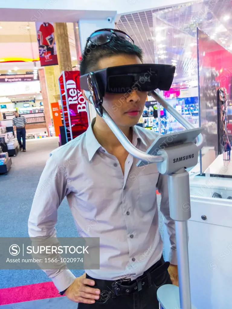 Paris, France, Chinese Man Using Three Dimensional Glasses 3D for High Definition T V  in VIrgin Store, Shopping on the Avenue Champs Elysees