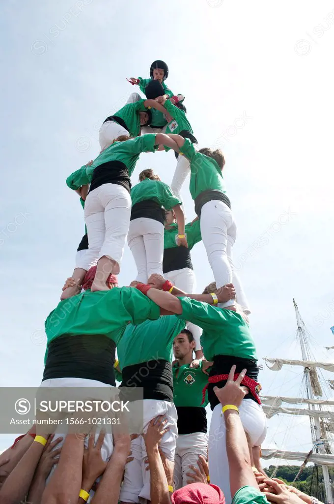 North Catalan´s castellers del riberal , human tower, at the ´temps fete douarnenez 2012´ international maritime festival, douarnenez france