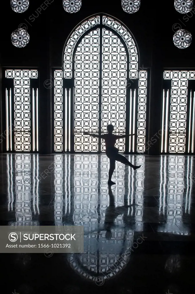 silhouette in the interior of the amazing Hassan II Mosque in Casablanca, Morocco