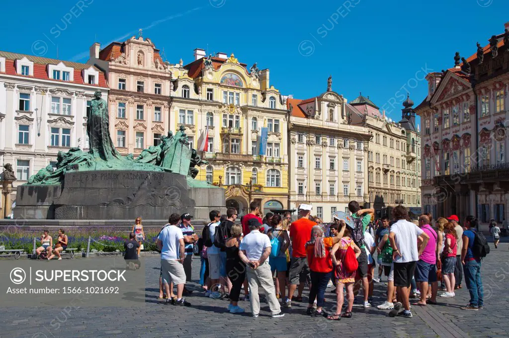 Tourist group at Jan Hus monument Staromestske namesti the old town square Stare mesto the old town Prague Czech Republic Europe