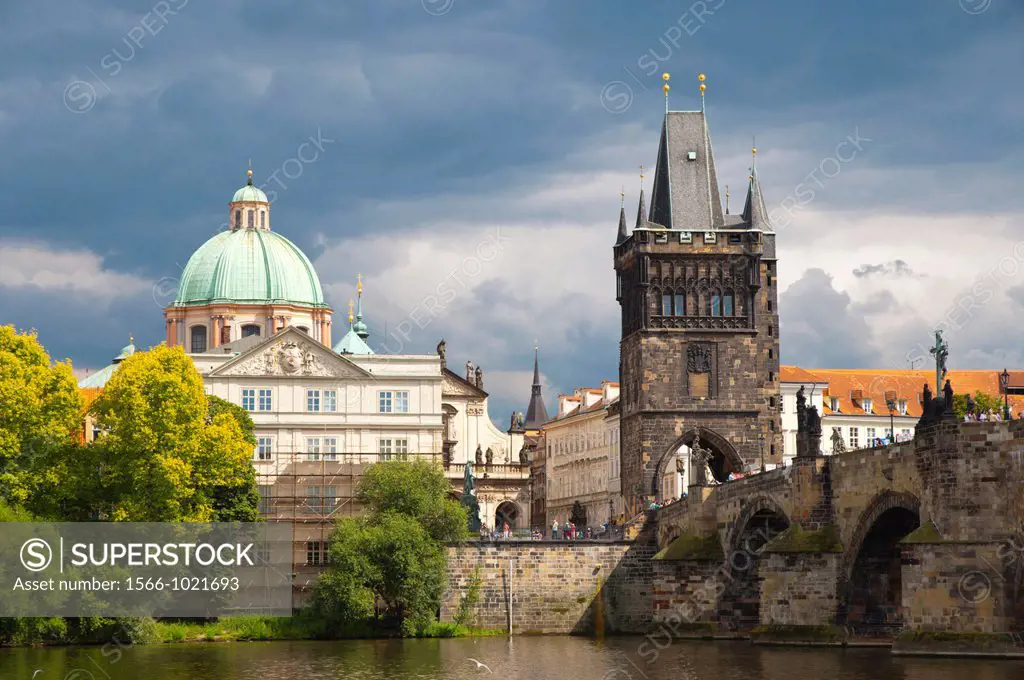 Charles bridge tower and buildings at old town riverside Prague Czech Republic Europe