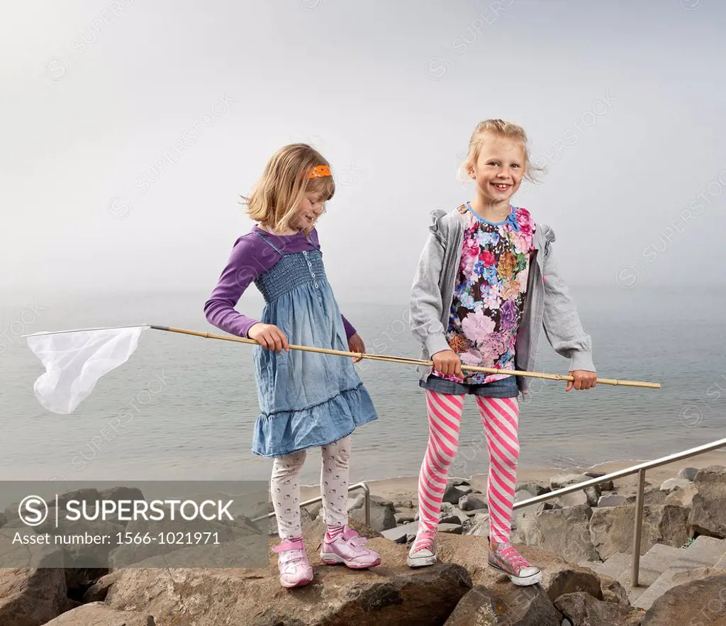 Girls at the beach fishing, Akranes, Iceland