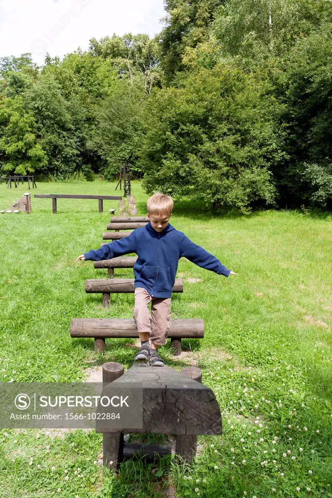 Boy practising on balance beam