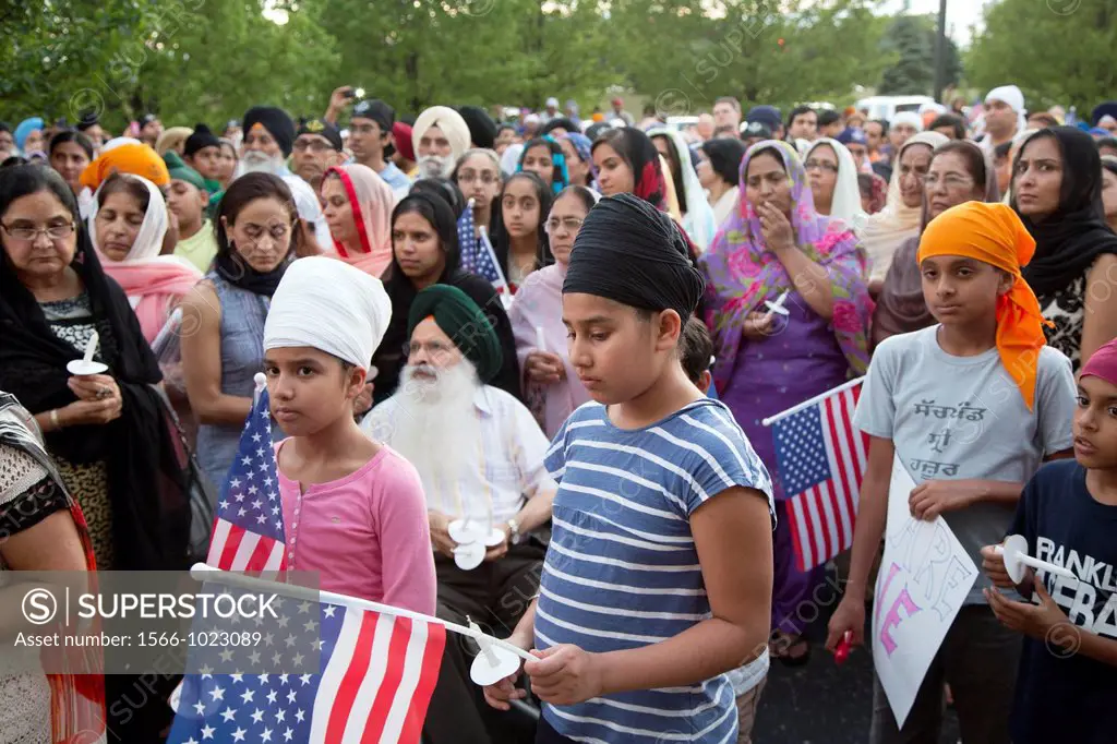 Plymouth, Michigan - Hundreds of Detroit-area Sikhs held a memorial service and candlelight vigil at the Hidden Falls Gurdwara temple for victims of t...