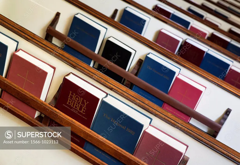 Pews with prayerbooks and hymnals
