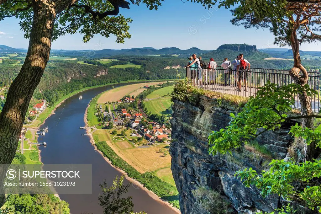 View from the spectacular rock formation Bastei Bastion to health resort Rathen and the Elbe River The Bastei is one of the most visited tourist attra...
