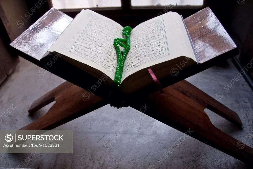 View of a Tasbih or Muslim Praying beads on top of the holy book Koran, Suleymanye Mosque, Istanbul, Turkey