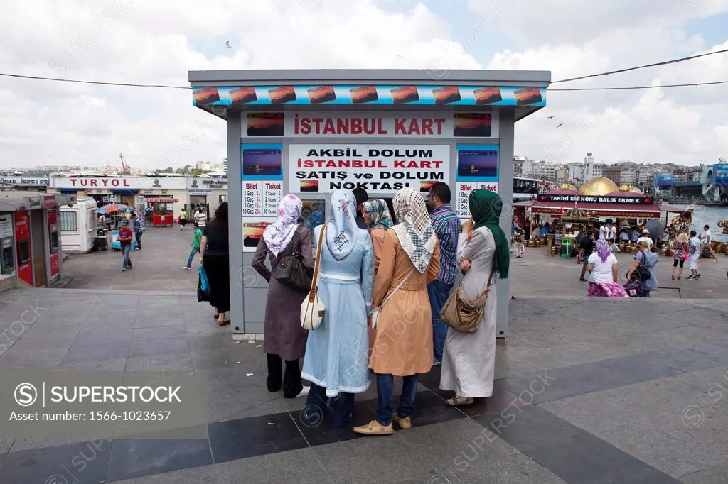 Turkish women buying ferry tickets at the bosphorus
