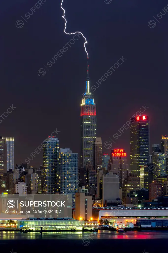 Lightning strikes the antenna on the top of the Empire State Building in New York City during a summer thunderstorm on Thursday, July 26, 2012. The Em...