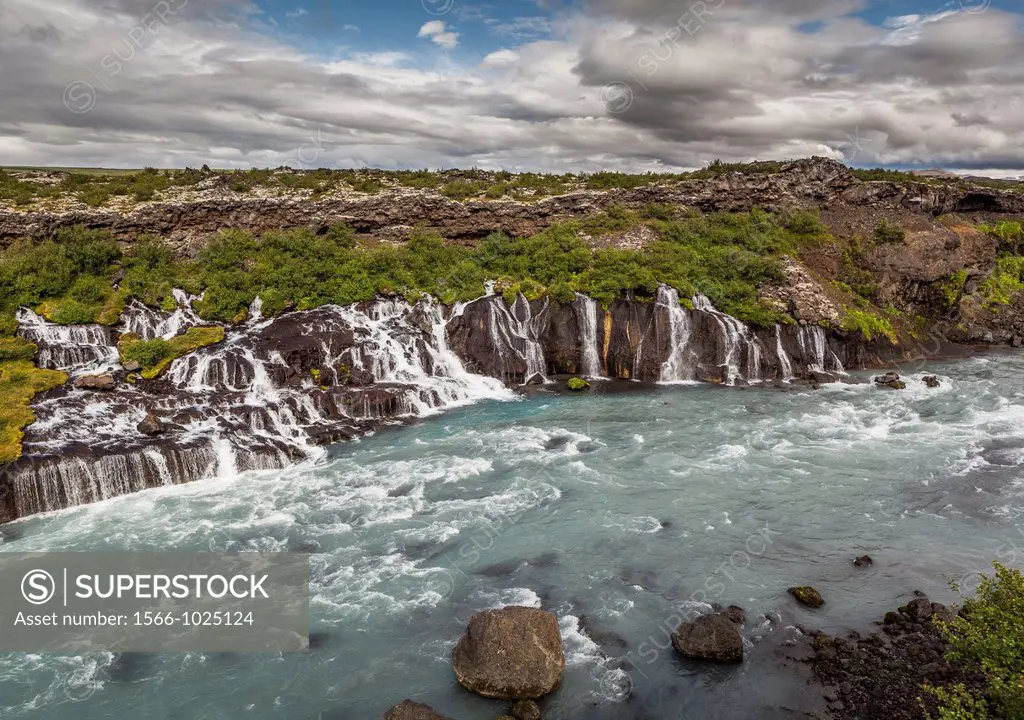 Hraunfossar waterfall flowing into the Hvita River Borgarfjordur, Iceland
