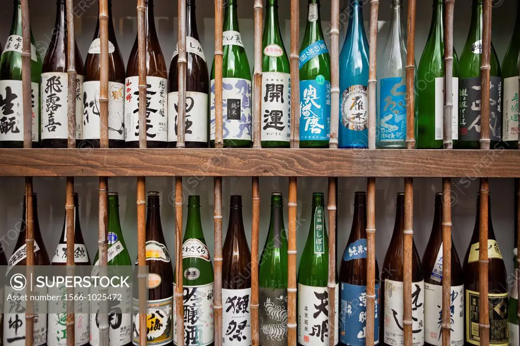 Sake bottles outside of restaurant, Tokyo, Japan