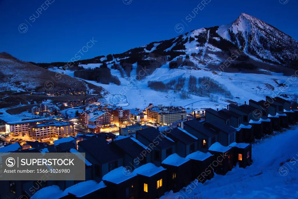 USA, Colorado, Crested Butte, Mount Crested Butte Ski Village, elevated view and Mount Crested Butte Mountain, winter, dusk
