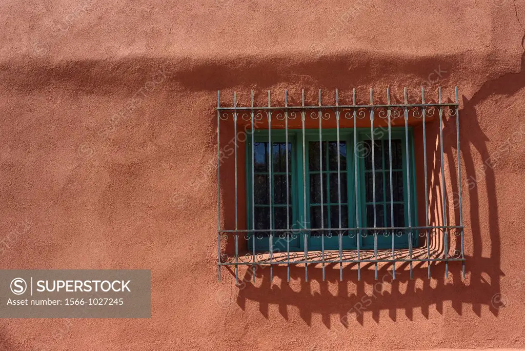 Spanish-style grilled window on adobe house, Santa Fe, New Mexico, USA