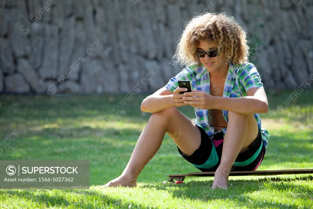 Teenage boy using his smart phone