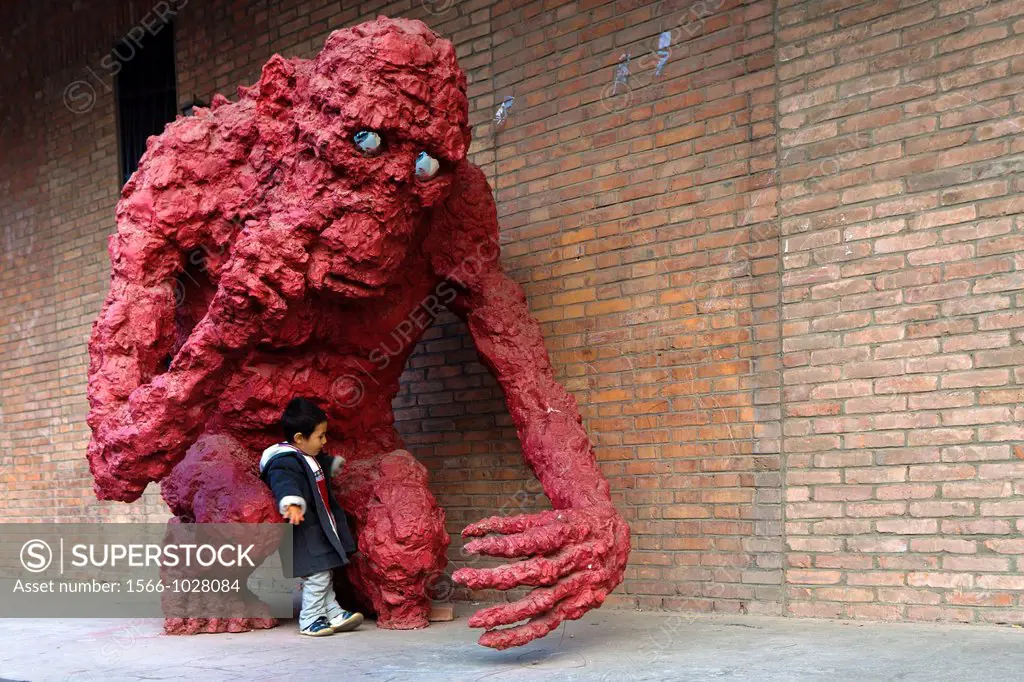 A monstrous clay sculpture with a boy at 798 Art Zone, a square kilometre of converted industrial site in Beijing´s northeastern Chaoyang District, Be...